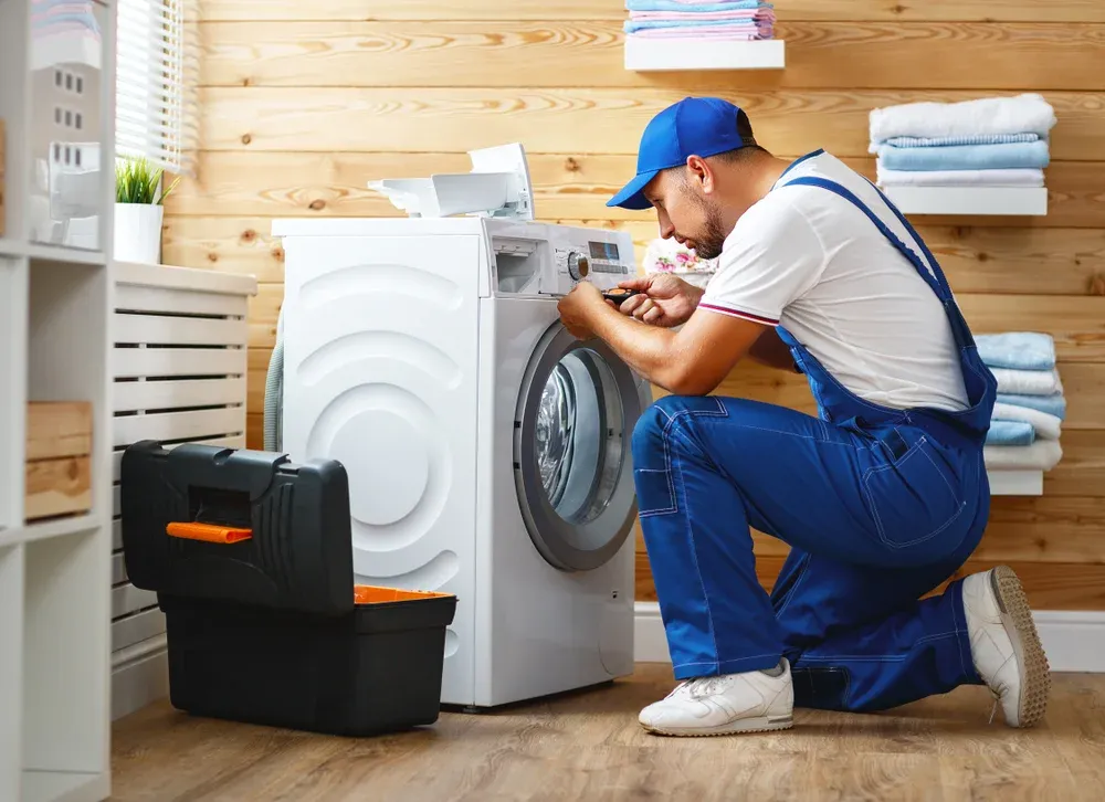 Ramson Appliances technician repairing a home appliance in Clermont, FL