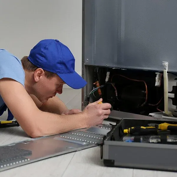 Ramson Appliances technician repairing a built-in appliance in Minneola, FL