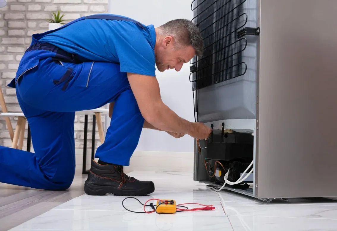 Technician servicing an appliance on a same-day repair visit in Groveland, FL