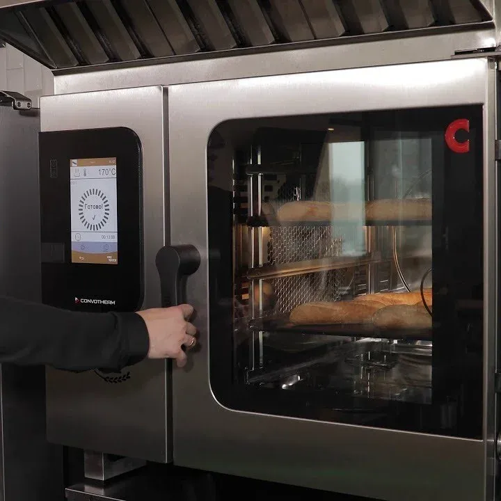 Convotherm combi oven with a touchscreen and baguettes baking inside