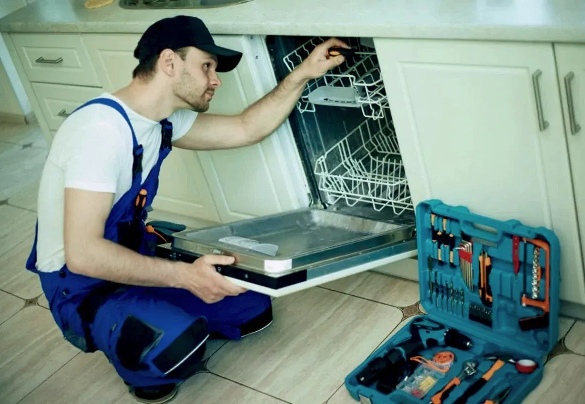 Technician servicing a built-in dishwasher on a same-day visit in Groveland, FL