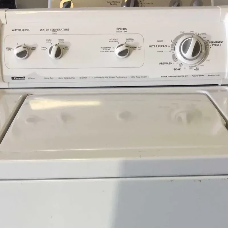 Control panel and lid of an almond Kenmore top-load washer