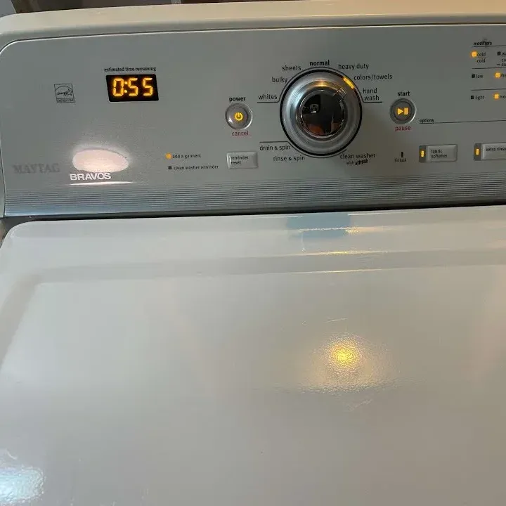 Control panel of a Maytag Bravos top-load washer with 55 minutes left on the timer