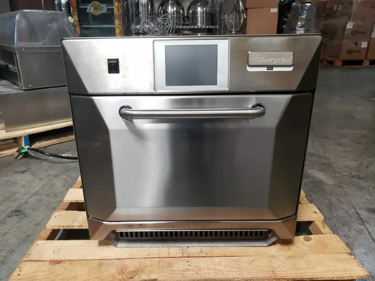 Stainless Merrychef high-speed oven with a touchscreen, on a wooden pallet