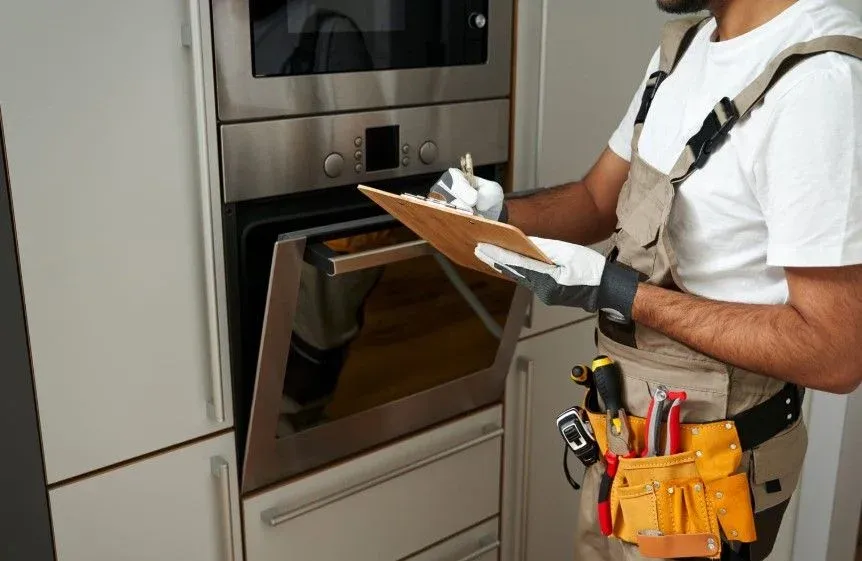Ramson Appliances technician servicing an oven on a same-day repair visit in Groveland, FL