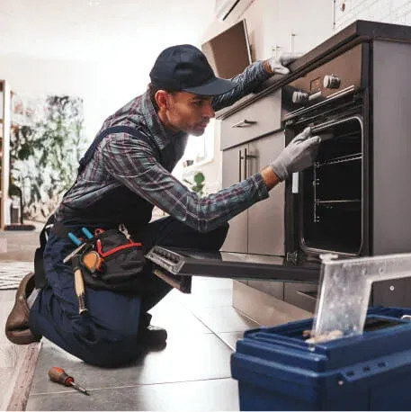 Ramson Appliances technician repairing a wall oven