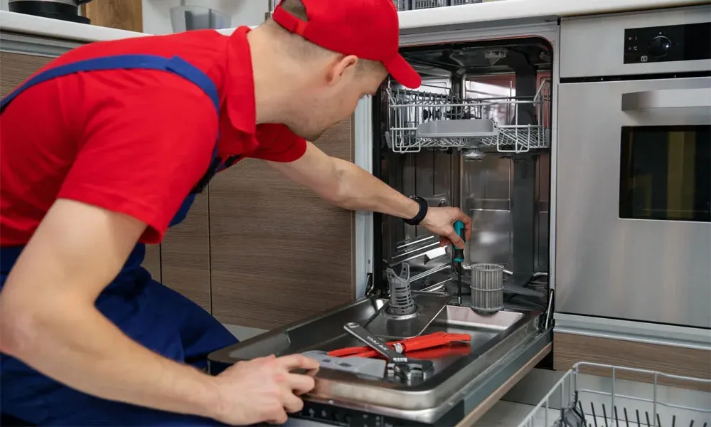 Ramson Appliances technician repairing a home appliance in Groveland, FL